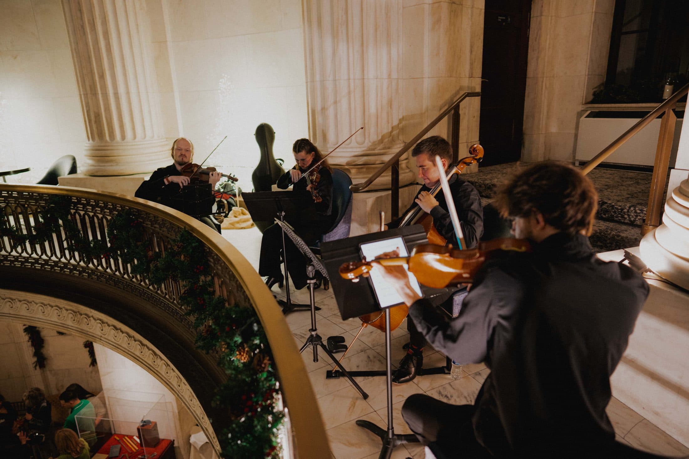 The quartet playing beneath a domed rotunda
