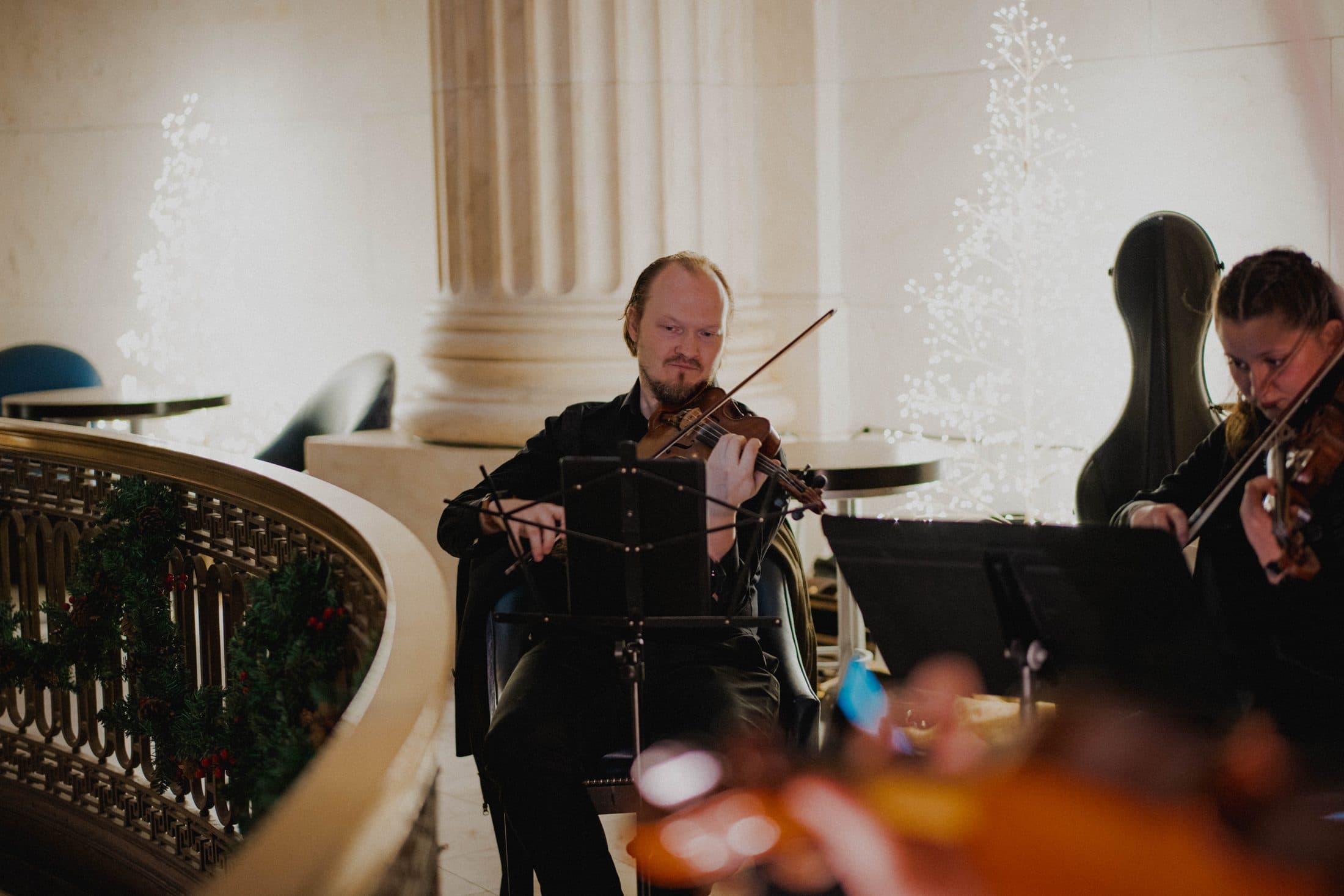 Violist performing at an evening reception